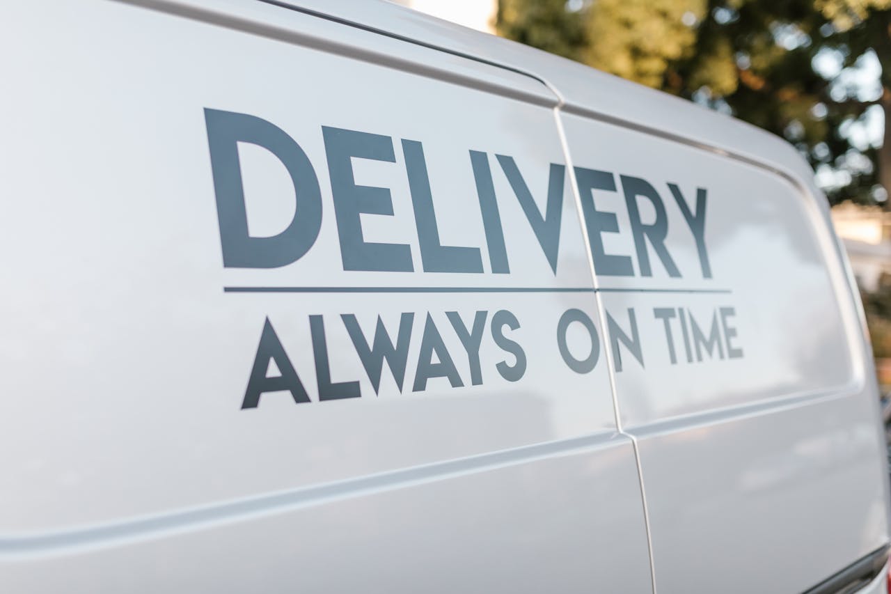 Services-01 Close-up of delivery van with slogan Always On Time emphasizing timely service.